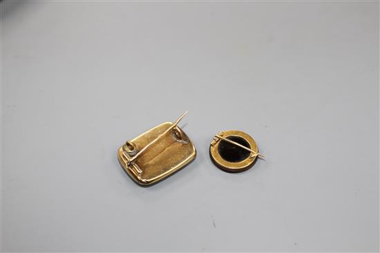Two brooches.
